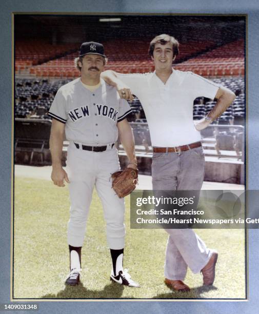 Steve Vucinich, A's equipment manager, in a photo with his favorite player, Catfish Hunter taken in 1979, hanging in his office in the club house...