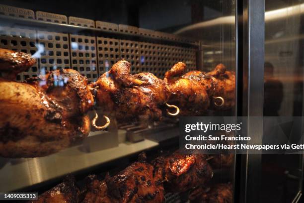 Roasted chickens in the rotisserie at Tacolicious in San Francisco, Calif., on Monday, July 24 where the delivery-only MFChicken restaurant is also...