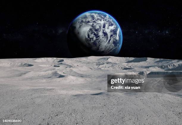 moon surface with distant earth and starfield - manen stockfoto's en -beelden