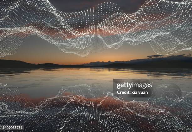 illuminated abstract particles wave over lake during sunset - plexus stock-fotos und bilder