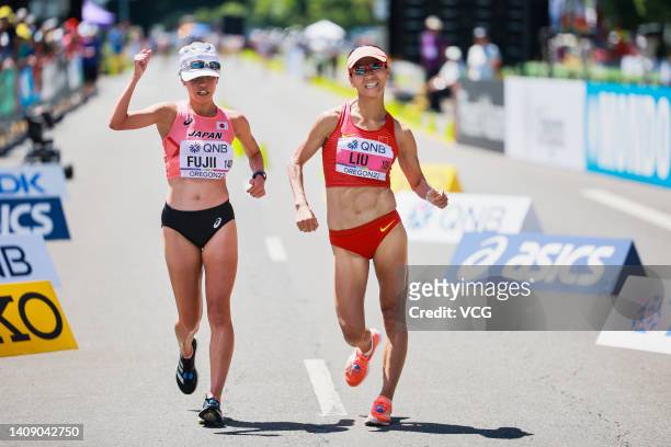 Nanako Fujii of Team Japan and Liu Hong of Team China compete in the Women's 20 Kilometer Race Walk on day one of the World Athletics Championships...