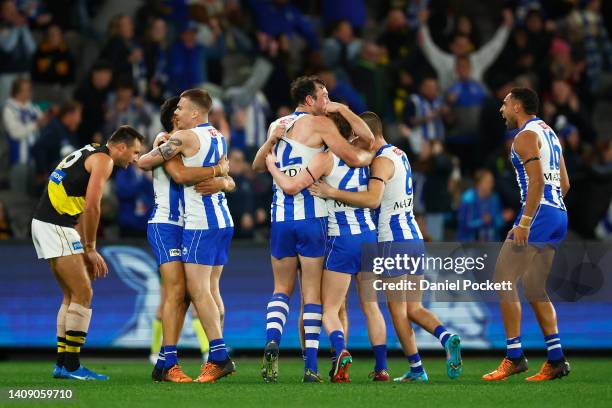 Kangaroos players celebrate winning the round 18 AFL match between the North Melbourne Kangaroos and the Richmond Tigers at Marvel Stadium on July...