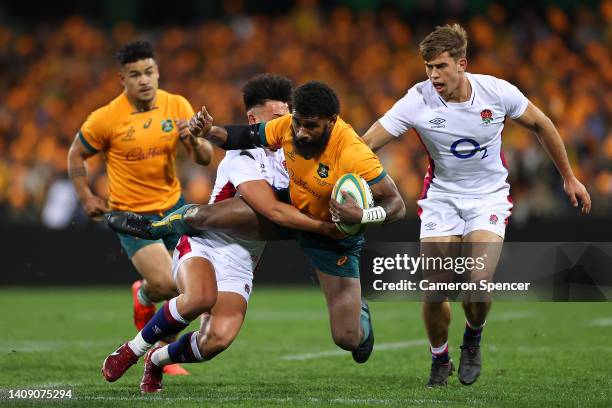 Marika Koroibete of the Wallabies is tackled by Marcus Smith of England during game three of the International Test match series between the...