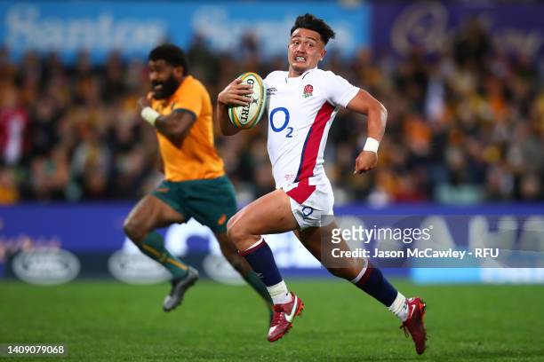 Marcus Smith of England makes a break to score a try during game three of the International Test match series between the Australia Wallabies and...