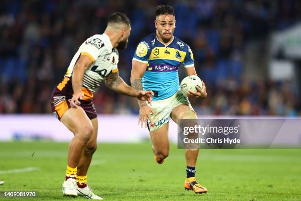 Phillip Sami of the Titans runs the ball during the round 18 NRL match between the Gold Coast Titans and the Brisbane Broncos at Cbus Super Stadium,...