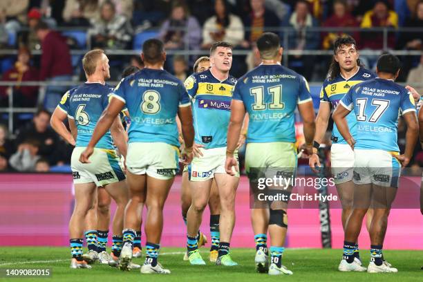 Titans look on after a Broncos try during the round 18 NRL match between the Gold Coast Titans and the Brisbane Broncos at Cbus Super Stadium, on...