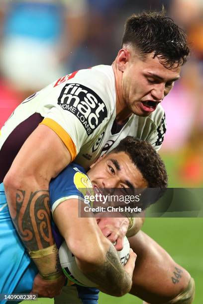 Sosefo Fifitaof the Titans is tackled during the round 18 NRL match between the Gold Coast Titans and the Brisbane Broncos at Cbus Super Stadium, on...