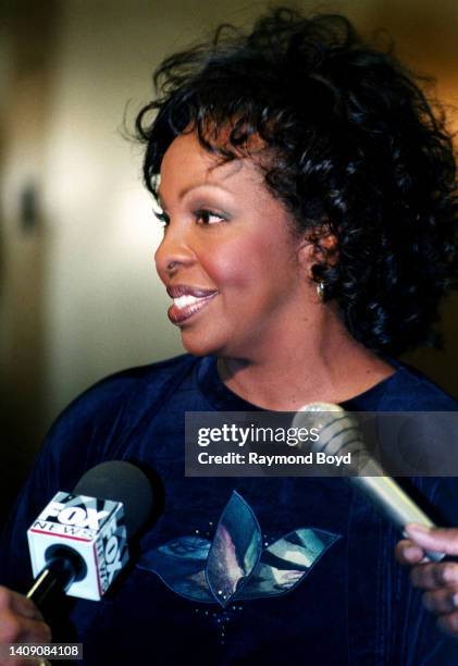 Singer Gladys Knight answers questions from the media during her 'Between Each Line of Pain and Glory: My Life Story' book signing at Afrocentric...