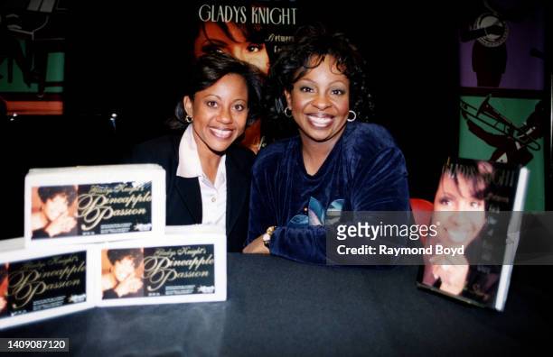 Singer Gladys Knight poses for photos with her daughter Kenya Newman during her 'Between Each Line of Pain and Glory: My Life Story' book signing at...