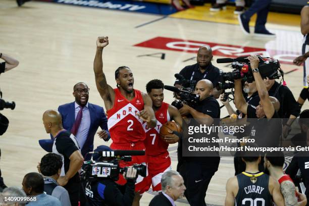 Toronto Raptors’ Kawhi Leonard and Kyle Lowry react after winning game 6 of the NBA Finals between the Golden State Warriors and the Toronto Raptors...
