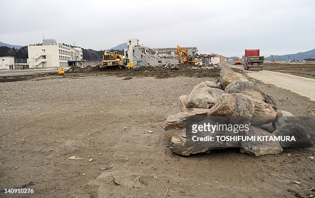 Heavy machinery disassembles the tsunami devastated buildings in Rikuzentakata city, Iwate prefectura on March 8, 2012. Japan is readying to mark the...