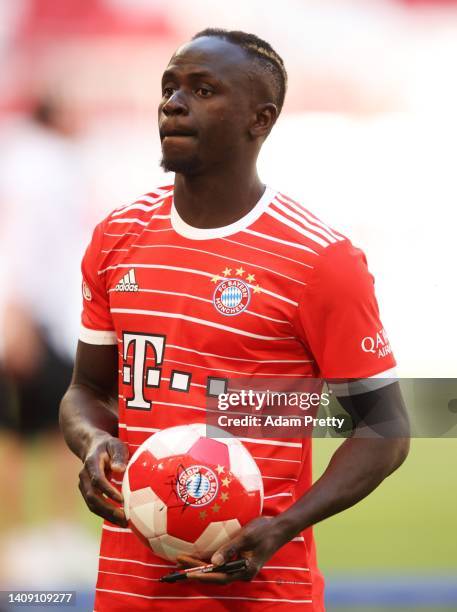 Sadio Mane of FC Bayern München signs a ball after the team presentation of FC Bayern München at Allianz Arena on July 16, 2022 in Munich, Germany.