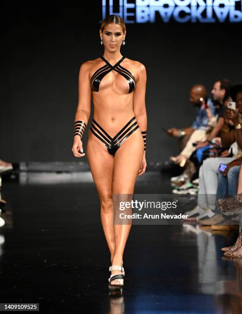 Carmen Carrera walks the runway wearing Black Tape Project at Miami Swim Week powered by Art Hearts Fashion at Faena Forum on July 15, 2022 in Miami...