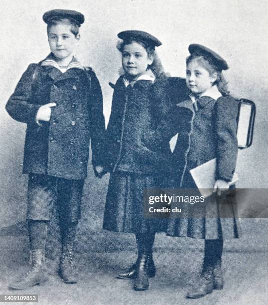 three pupils with satchels, front view - elementary student portrait stock illustrations