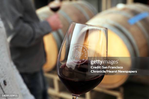 Jim Woods, founder and CEO holds a glass of Pinot Noir at Woods Island Club on Treasure Island in San Francisco, Calif., on Tuesday, December 10,...