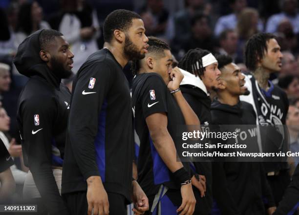 Several of the Warriors players watch from the bench as the Golden State Warriors played the New York Knicks at Chase Center in San Francisco,...