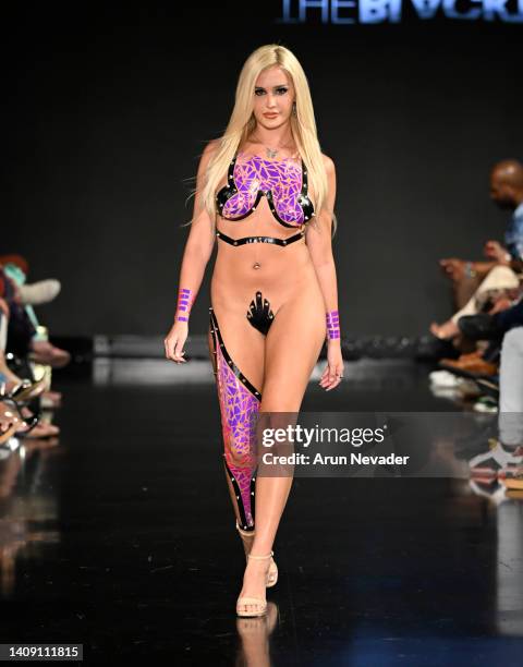 Daylon Muenzner walks the runway wearing Black Tape Project at Miami Swim Week powered by Art Hearts Fashion at Faena Forum on July 15, 2022 in Miami...