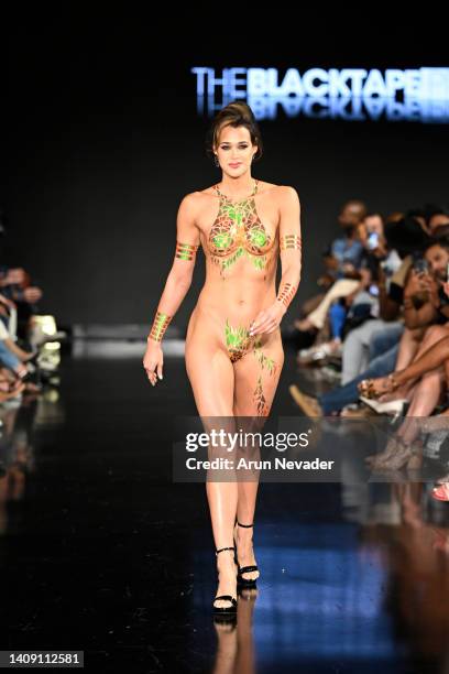 Model walks the runway wearing Black Tape Project at Miami Swim Week powered by Art Hearts Fashion at Faena Forum on July 15, 2022 in Miami Beach,...