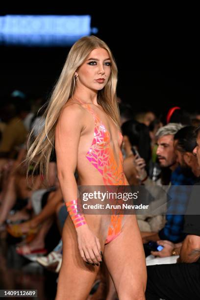 Model walks the runway wearing Black Tape Project at Miami Swim Week powered by Art Hearts Fashion at Faena Forum on July 15, 2022 in Miami Beach,...