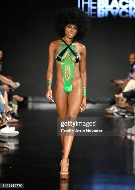 Model walks the runway wearing Black Tape Project at Miami Swim Week powered by Art Hearts Fashion at Faena Forum on July 15, 2022 in Miami Beach,...