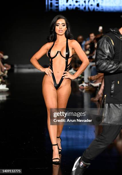 Model walks the runway wearing Black Tape Project at Miami Swim Week powered by Art Hearts Fashion at Faena Forum on July 15, 2022 in Miami Beach,...