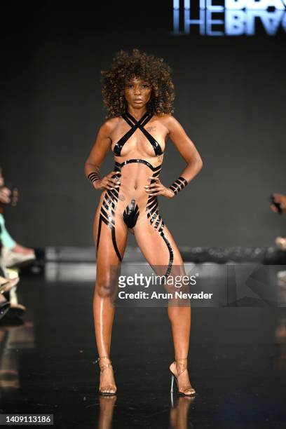Kaye Cox walks the runway wearing Black Tape Project at Miami Swim Week powered by Art Hearts Fashion at Faena Forum on July 15, 2022 in Miami Beach,...