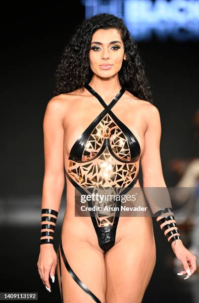 Model walks the runway wearing Black Tape Project at Miami Swim Week powered by Art Hearts Fashion at Faena Forum on July 15, 2022 in Miami Beach,...