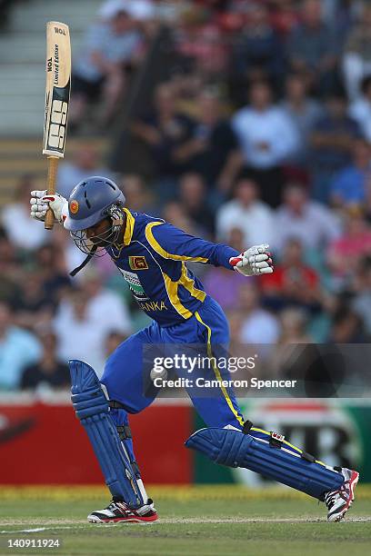 Upul Tharanga of Sri Lanka loses the ball as he attempts a shot during the third One Day International Final series match between Australia and Sri...