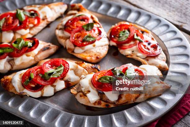 grilled caprese chicken - caprese salad stock pictures, royalty-free photos & images