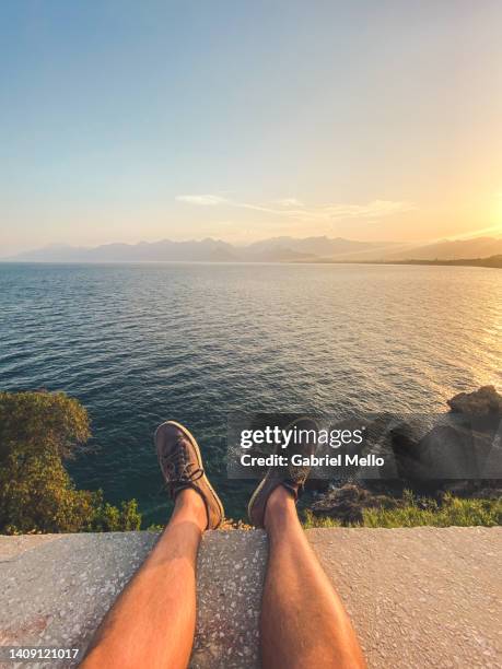 pov of man legs at the edge - stadt antalya stock-fotos und bilder