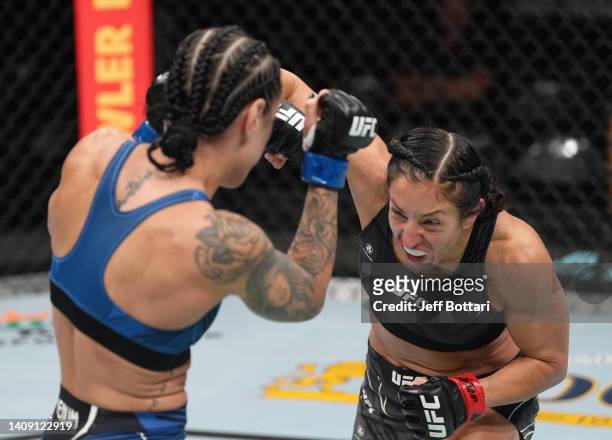 Jessica Penne punches Emily Ducote in a strawweight fight during the UFC Fight Night event at UBS Arena on July 16, 2022 in Elmont, New York.