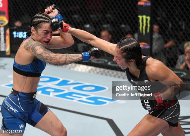 Jessica Penne punches Emily Ducote in a strawweight fight during the UFC Fight Night event at UBS Arena on July 16, 2022 in Elmont, New York.