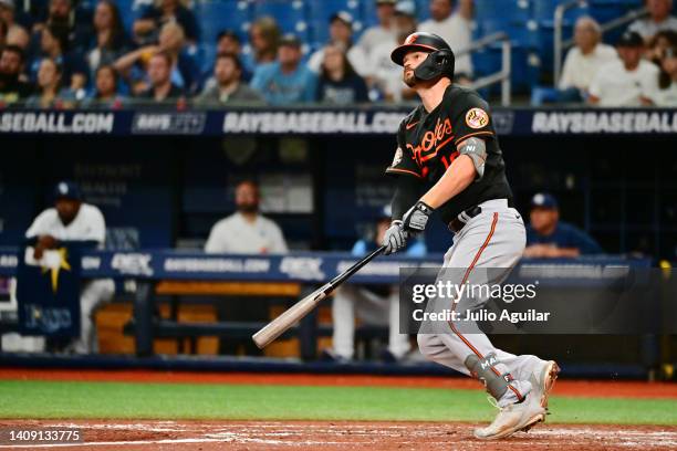 Trey Mancini of the Baltimore Orioles watches the ball after hitting a home run in the third inning against the Tampa Bay Rays at Tropicana Field on...