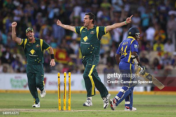 Clint McKay of Australia celebrates taking the wicket of Rangana Herath of Sri Lanka during the third One Day International Final series match...