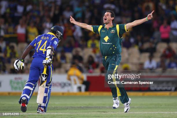 Clint McKay of Australia celebrates taking the wicket of Rangana Herath of Sri Lanka during the third One Day International Final series match...