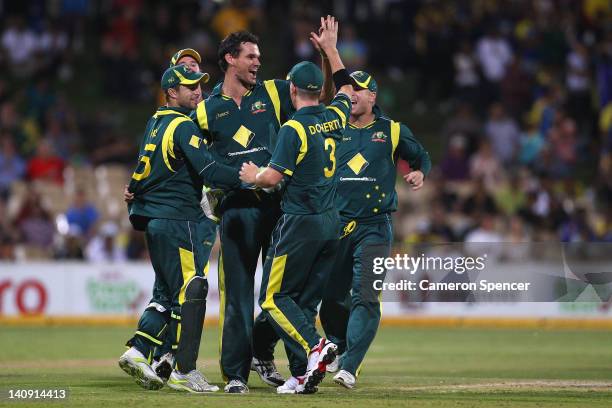 Clint McKay of Australia celebrates taking the wicket of Rangana Herath of Sri Lanka during the third One Day International Final series match...