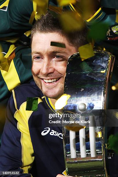 Michael Clarke of Australia holds the Commonwealth Bank series trophy after the third One Day International Final series match between Australia and...