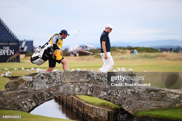David Carey of Ireland crosses the Swilcan Bridge on the 18th green during Day Three of The 150th Open at St Andrews Old Course on July 16, 2022 in...