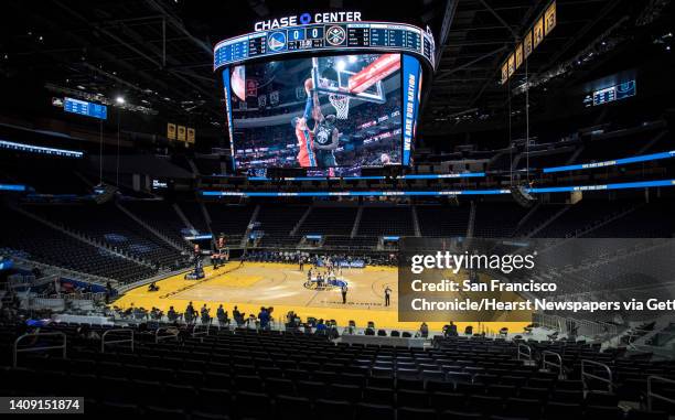 The Chase Arena is empty except for team personnel and media during the first half as the Golden State Warriors played the Denver Nuggets in their...