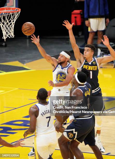 Stephen Curry puts up a shot during the first half as the Golden State Warriors played the Denver Nuggets in their first preseason game at Chase...