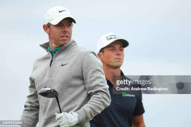 Rory McIlroy of Northern Ireland and Viktor Hovland of Norway look on at the 15th tee during Day Three of The 150th Open at St Andrews Old Course on...