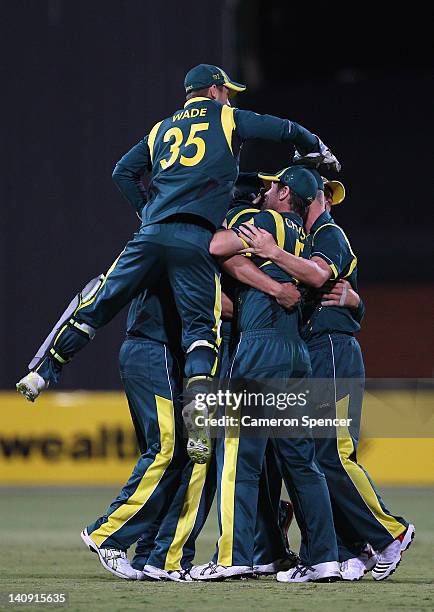 Australian players celebrate winning the third One Day International Final series match between Australia and Sri Lanka at Adelaide Oval on March 8,...