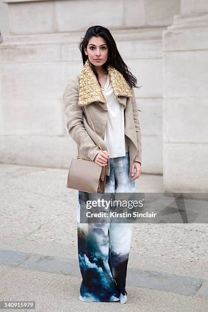 Anna Nooshin, executive editor of nsmbl wearing Marlous Blaas trousers, Dennis thm jacket, brooms bazaar top, vintage bag, Michael Kors shoes at...