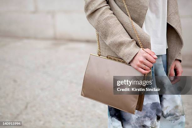 Anna Nooshin, executive editor of nsmbl wearing Marlous Blaas trousers, Dennis thm jacket, brooms bazaar top, vintage bag at Paris Fashion Week...