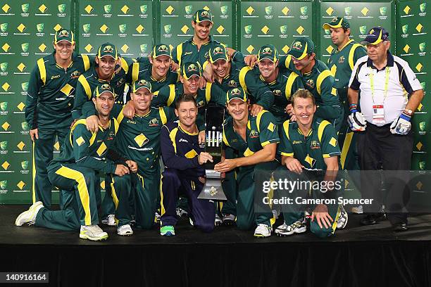 Australian players celebrate with the trophy after winning the third One Day International Final series match between Australia and Sri Lanka at...
