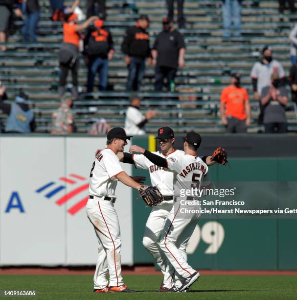 Outfielders Alex Dickerson Austin Slater Mike Yastrzemski celebrate the Giants win as the San Francisco Giants defeated the Colorado Rockies 3-1 at...