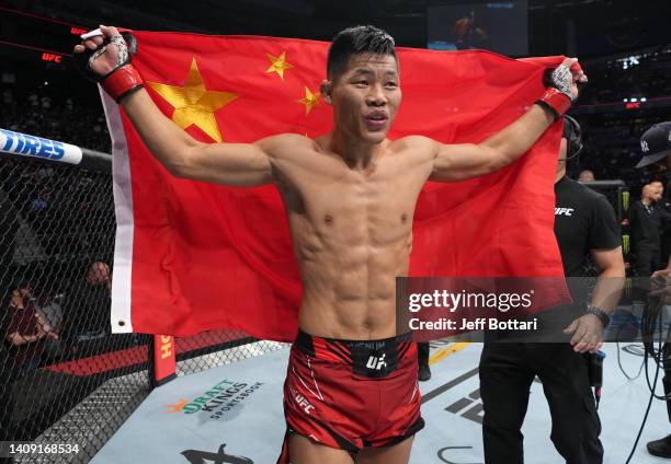 Li Jingliang of China reacts after his victory over Muslim Salikhov of Russia in a welterweight fight during the UFC Fight Night event at UBS Arena...