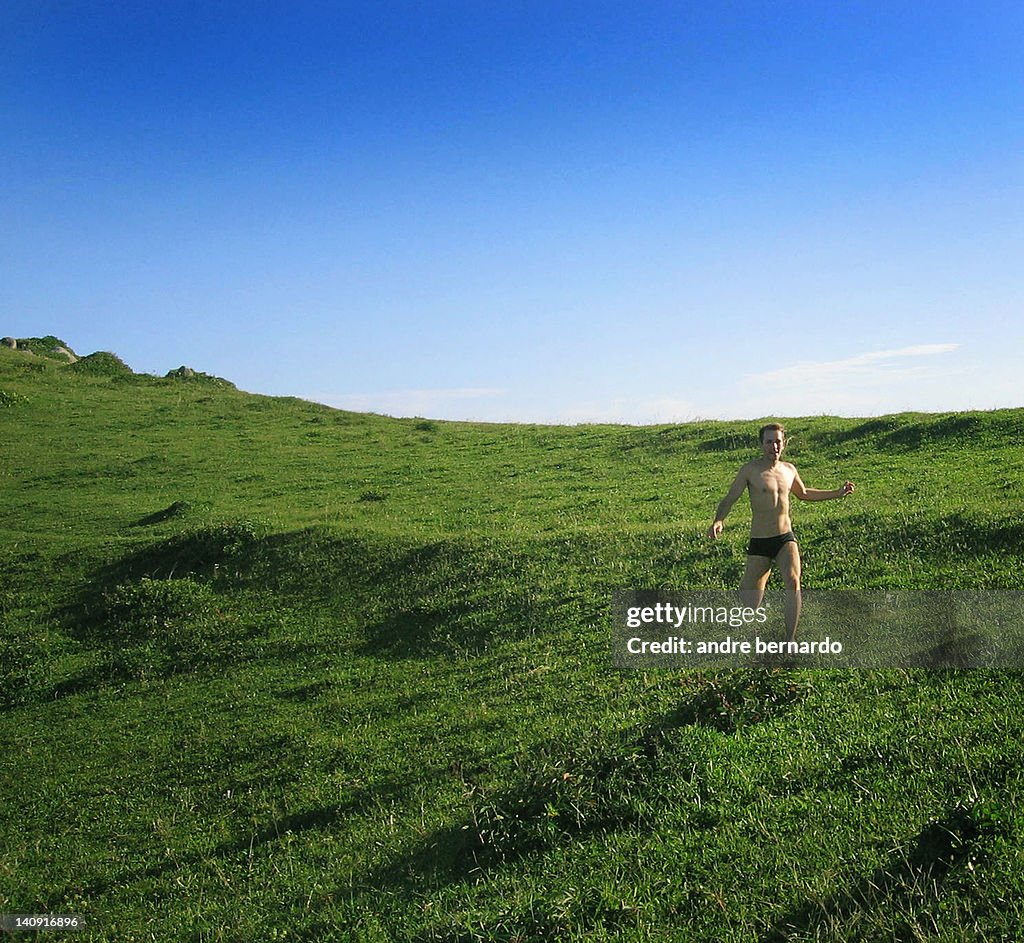 Man running on green grass