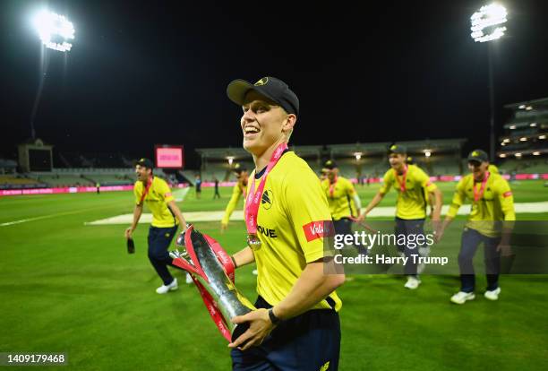 Nathan Ellis of Hampshire Hawks celebrates alongside their teams with the Vitality Blast Trophy following the Vitality Blast Final match between...