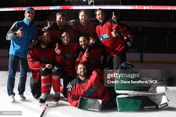 Head coach Guy Carbonneau of Team Carbonneau poses with his team after defeating Team LeClair 6-5 in the final during 3ICE Week Five at Budweiser...
